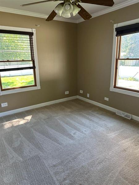 Freshly vacuumed carpeted bedroom