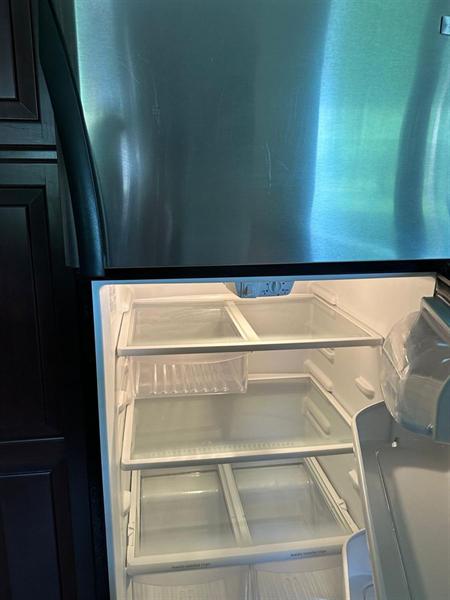 Refrigerator shelves and drawers deep cleaned