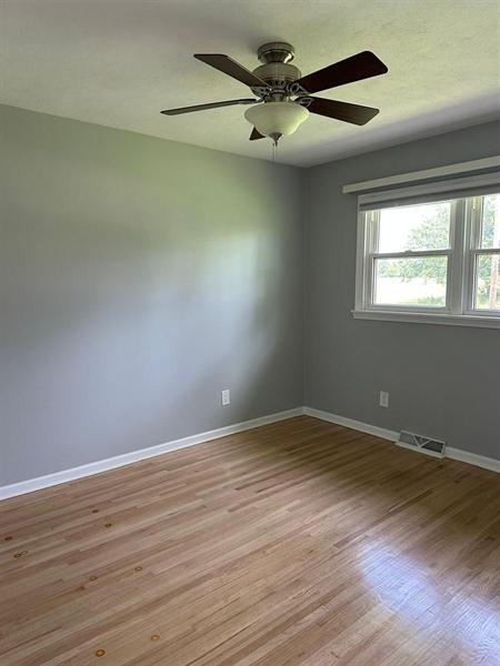 Bedroom with hardwood floor cleaned by Diamond Shine