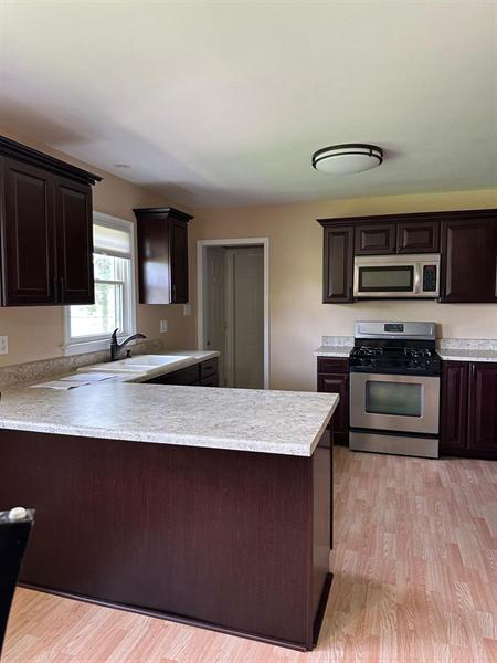 Kitchen with countertops and cabinets cleaned