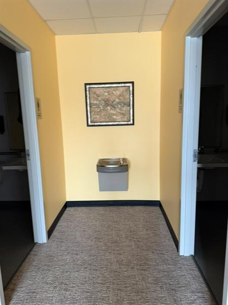 Office restroom entryway and water fountain cleaned