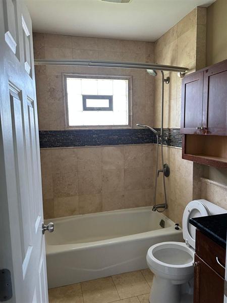 Bathroom with tub and toilet cleaned